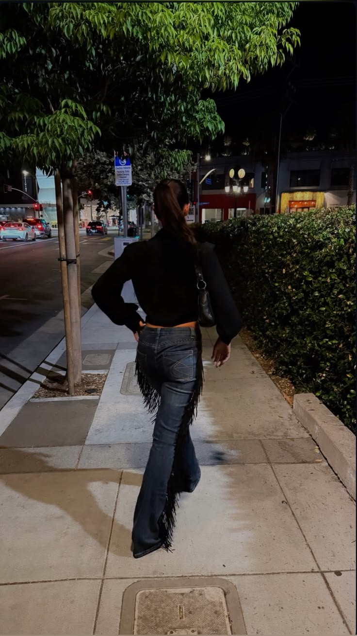 Fringe bootcut jeans worn on the street